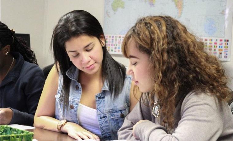 two female students reading